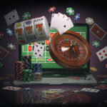 Online casino concept. Laptop with roulette, slot machine, casin