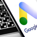 Google Ads symbol on the screen smartphone and notebook backgrou