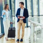 Businesswomen hold luggage travel to business trip.