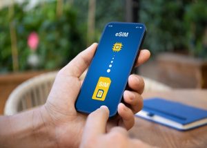 Man hand hold phone with Sim card replacement on eSim
