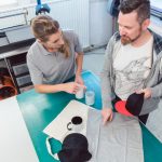 Man and woman discussing which promotional items to use